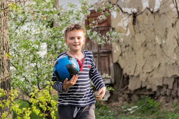 Boy Outdoors Ball Playing Football Grass Spring Village —  Fotos de Stock