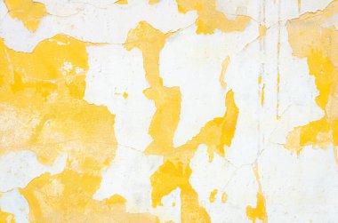 Bir sürü çizik ve kusurlu sarı ve beyaz boyalı duvar.