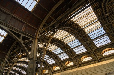 Beautiful geometric abstraction from old arched metal structures that are connected by rivets and bend at different angles