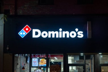 Toronto, ON, Canada  December 13, 2021:  Domino s Pizza Store front with and blue franchise sign.