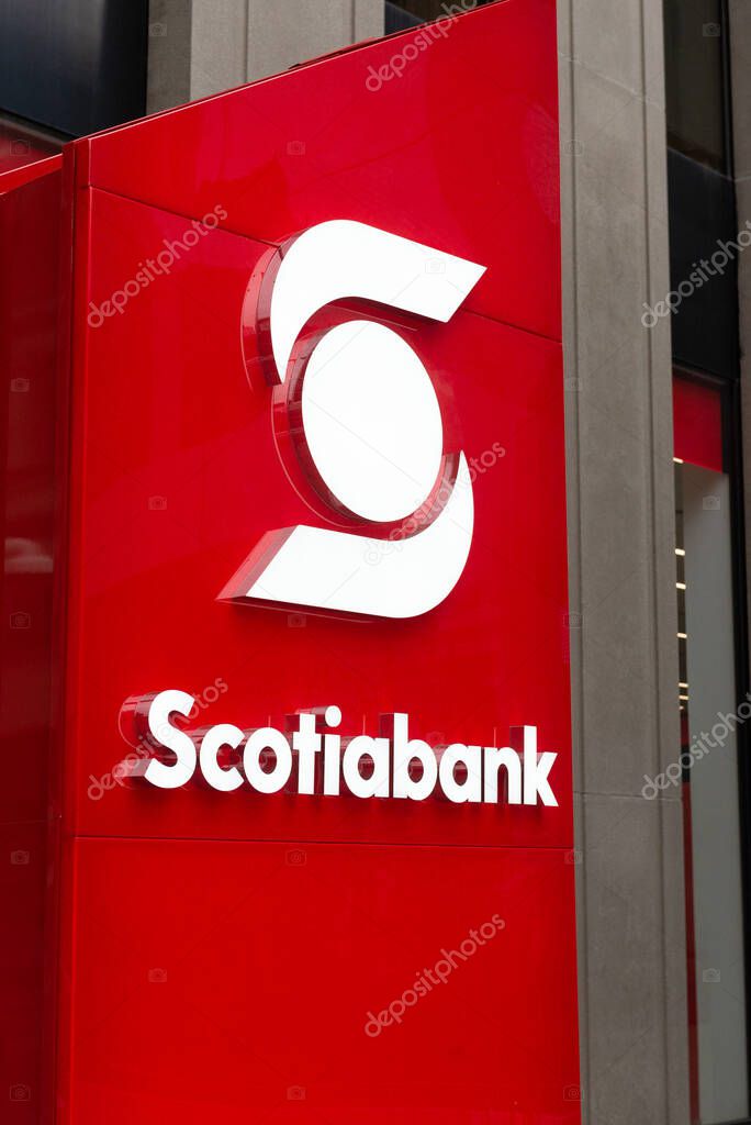 Toronto, ON, Canada  December 05, 2021: The logo and brand sign of Scotiabank in downtown Toronto.  The Bank of Nova Scotia  is a Canadian multinational banking and financial services company