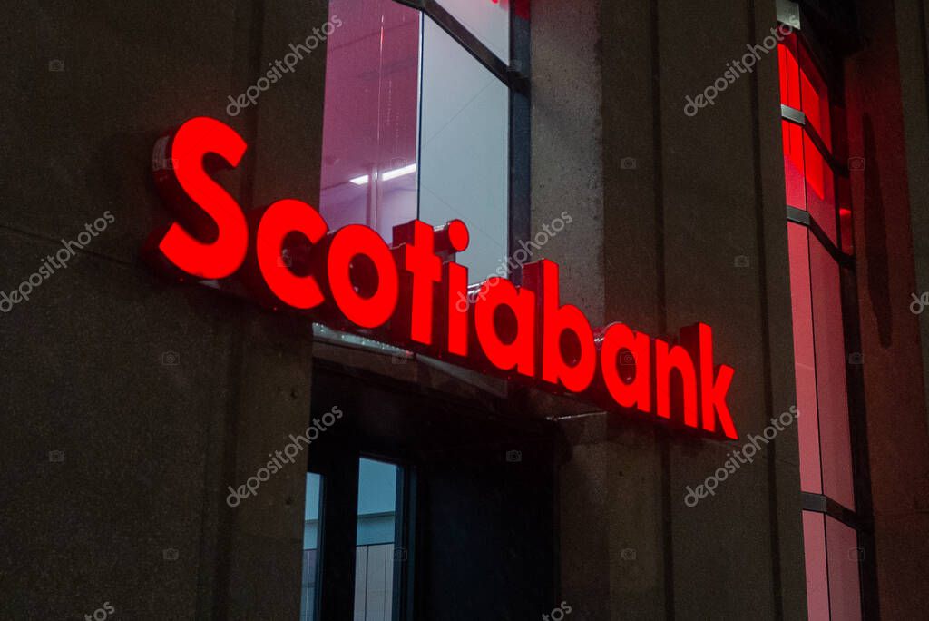 Toronto, ON, Canada  December 05, 2021: The logo and a brand sign of Scotiabank in downtown Toronto.  The Bank of Nova Scotia (Scotiabank) is a Canadian multinational banking and financial services company