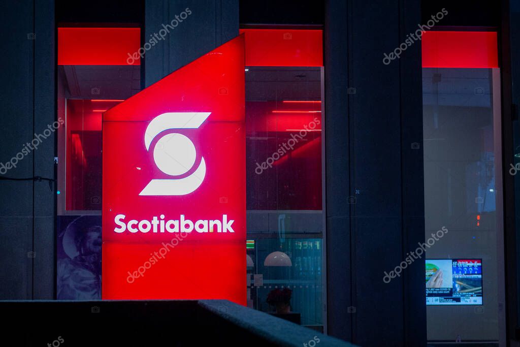 Toronto, ON, Canada  December 05, 2021: The logo and a brand sign of Scotiabank in downtown Toronto.  The Bank of Nova Scotia (Scotiabank) is a Canadian multinational banking and financial services company