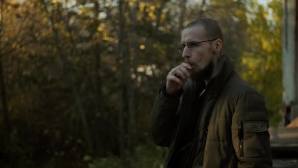 Bearded Man Glasses Smoking Electronic Cigarette Blowing Smoke Enjoying Vaping — Stock Video