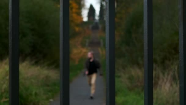 Man Runs Path Being Deffenetly Scared Something Someone Hits Enclosure — Stock Video