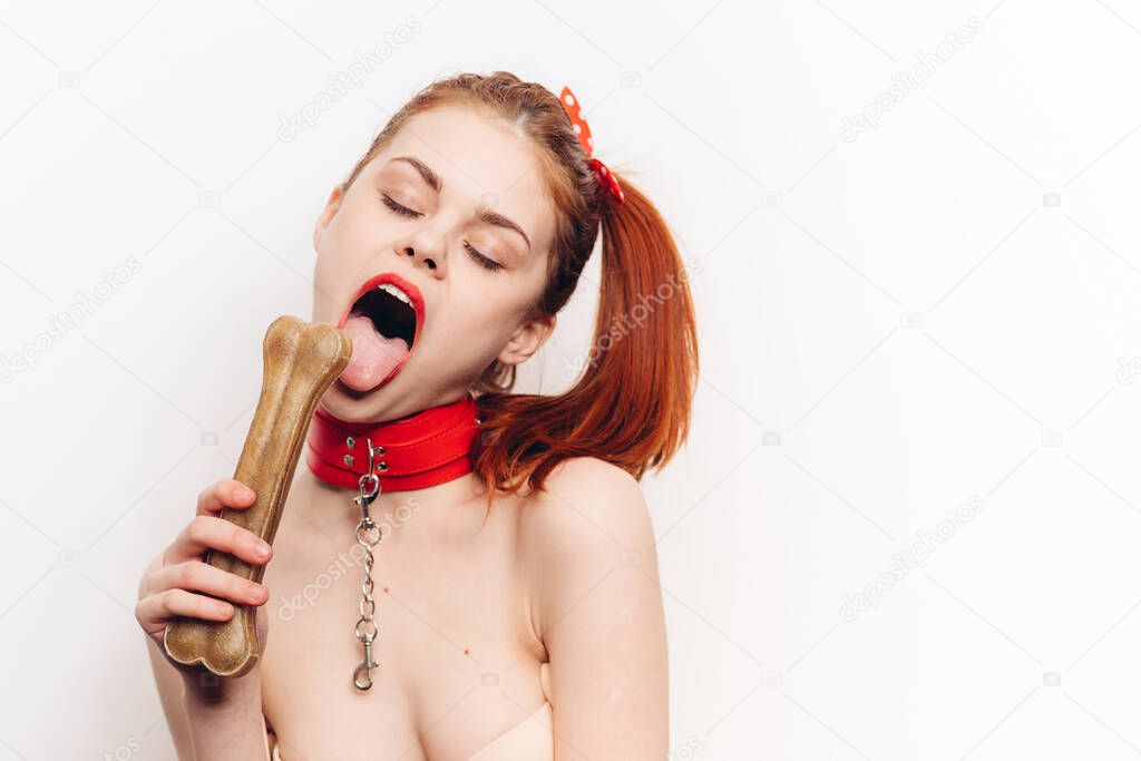 pretty woman with leash around her neck dog bone costume posing