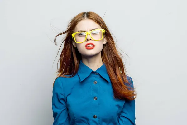 Woman in blue shirt yellow glasses charm glamor — Stock Photo, Image