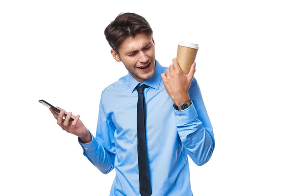 Manager communication on the phone a cup of coffee light background — Stock Photo, Image