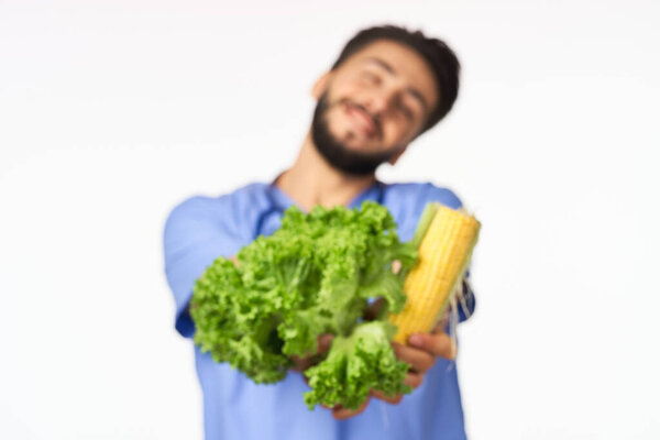 male nutritionist with vegetables in the hands of health calories