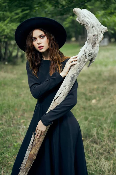Woman in witch costume fantasy magic forest posing — Stock Photo, Image