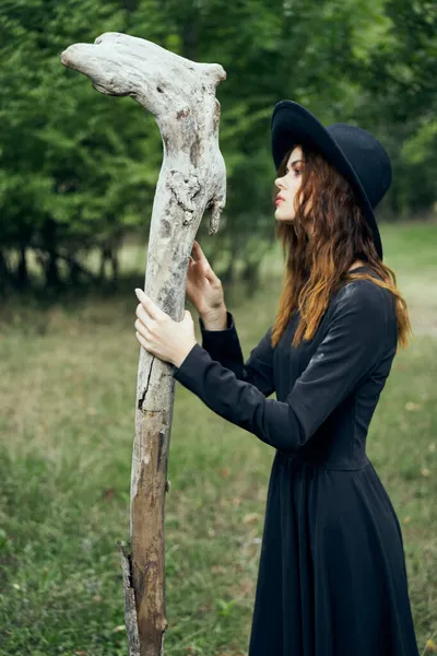 Woman in witch costume fantasy magic forest posing — Stock Photo, Image