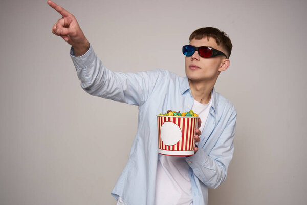 guy wearing virtual glasses technology entertainment popcorn