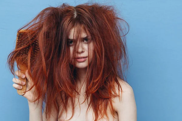 Woman with red hair comb care blue background — Stock Photo, Image