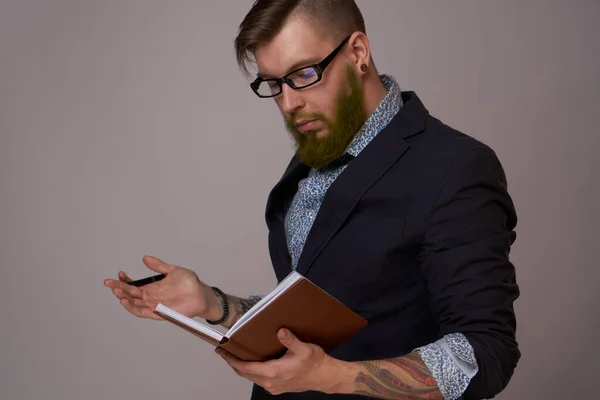 Manager in a jacket with a notebook in his hands work office — Stock Photo, Image