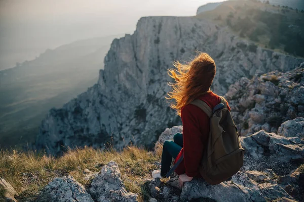 woman hiker sitting on mountain landscape nature fresh air