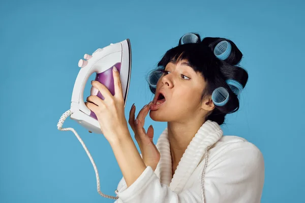 Woman in white robe housework cleaning service blue background — Stock Photo, Image