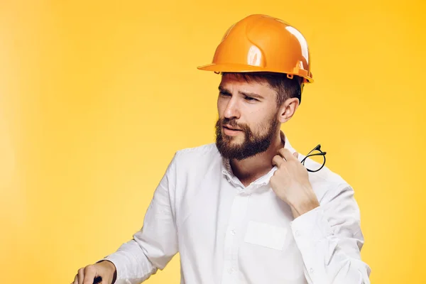 Man in orange helmet construction engineer working professional — Stock Photo, Image