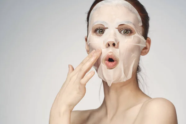 Pretty woman naked shoulders face mask close-up skin care — Stock Photo, Image