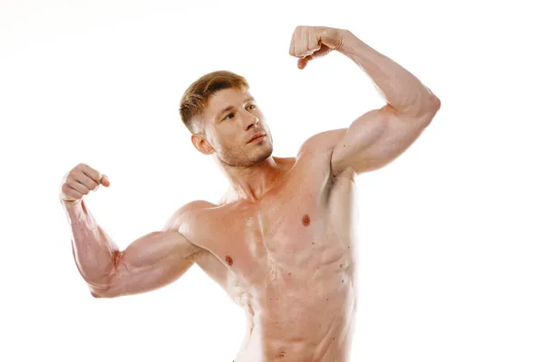 Athletic man pumped up press gestures with hands posing fitness — Stock Photo, Image