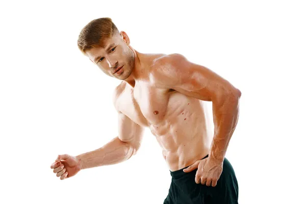 Hombre con un cuerpo bombeado musculación primer plano entrenamiento culturistas —  Fotos de Stock