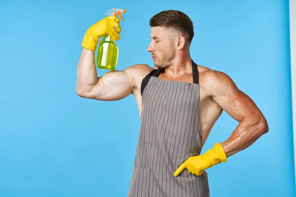 Man wearing an apron detergent cleaning service housework — Stock Photo, Image