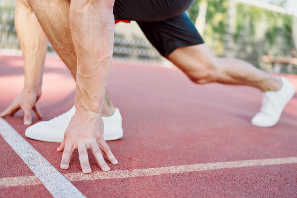 athletic man on sports ground workout exercise crossfit summer