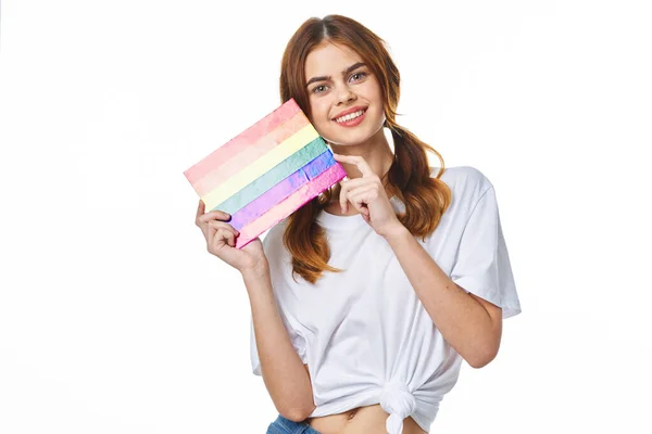 Woman wearing white t-shirt lgbt flag inventor community — ストック写真