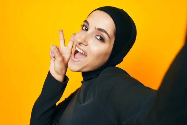 Arab woman fun ethnic model posing emotions yellow background — 图库照片