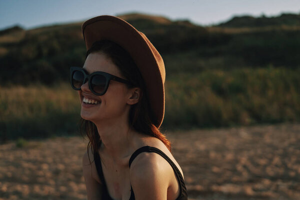 woman in sunglasses near car travel summer vacation landscape