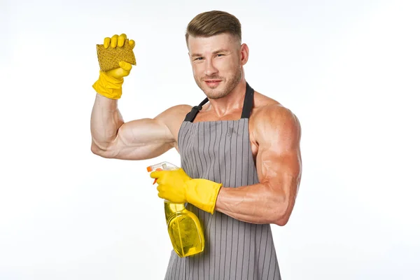 Sportlicher muskulöser Mann mit Putzmittel in Pose — Stockfoto
