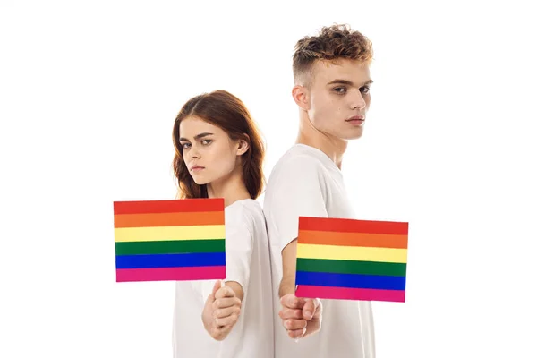 Joven pareja lgbt bandera transgénero estilo de vida luz fondo — Foto de Stock