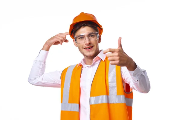 Uomo in uniforme da lavoro casco arancione sicurezza lavoro professionale — Foto Stock