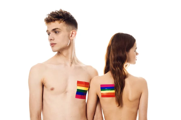 Jong paar lgbt vlag transgender lifestyle licht achtergrond — Stockfoto