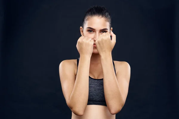 Woman athlete fitness workout exercise close-up black background — Stock Photo, Image