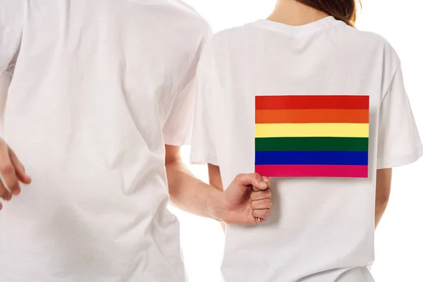 Pareja bandera lgbt transexual sexual minorías luz fondo — Foto de Stock
