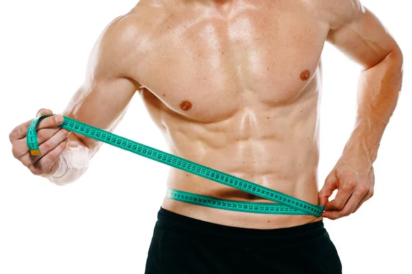 Athletic man with measuring tape muscle workout — Stock Photo, Image