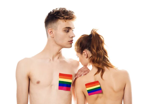 Couple Drapeau lgbt transgenre minorités sexuelles lumière arrière-plan — Photo