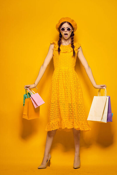 pretty woman shopping entertainment lifestyle yellow background