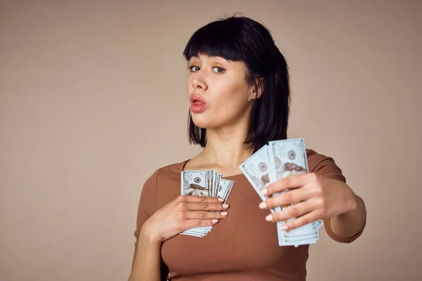 emotional woman with money in hands finance positive
