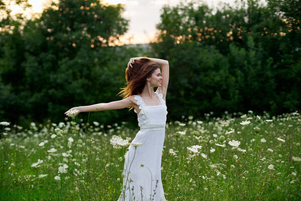 Woman in white dress posing dance nature summer. High quality photo