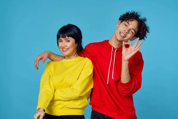 Young couple in fashionable clothes posing together emotions lifestyle — Stock Photo, Image