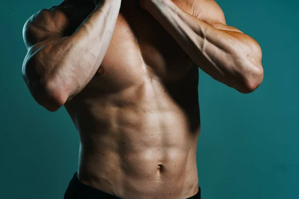 Athletic man with pumped up muscular body workout green background — Stock Photo, Image