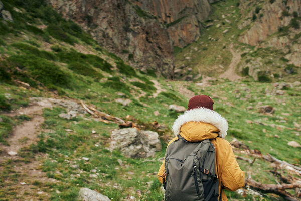 woman hiker with backpack mountains travel adventure freedom