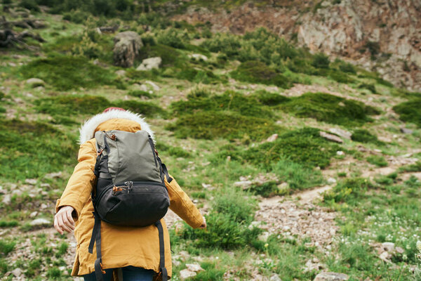 woman hiker with backpack mountains travel adventure freedom
