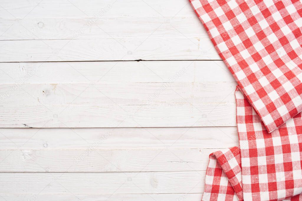 Red checkered tablecloth wooden background texture kitchen decoration