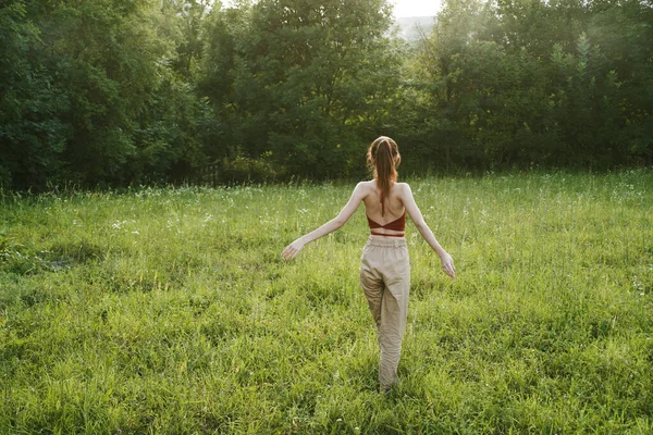 Woman exercising outdoors freedom summer nature recreation — Stock Photo, Image