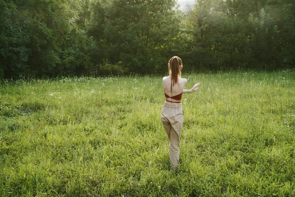 Woman exercising outdoors freedom summer nature recreation — Stock Photo, Image