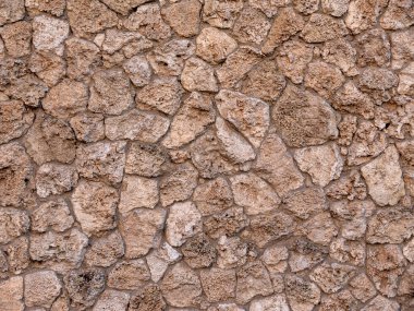 Geçmişi ve dokusu. Duvar doğal taşla kaplı..