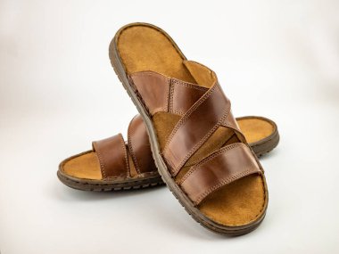 Male brown leather sandals. Close up on the white background.
