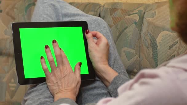 Adult Woman Holding Tablet Computer Green Screen Lies Sofa Home — Vídeo de Stock